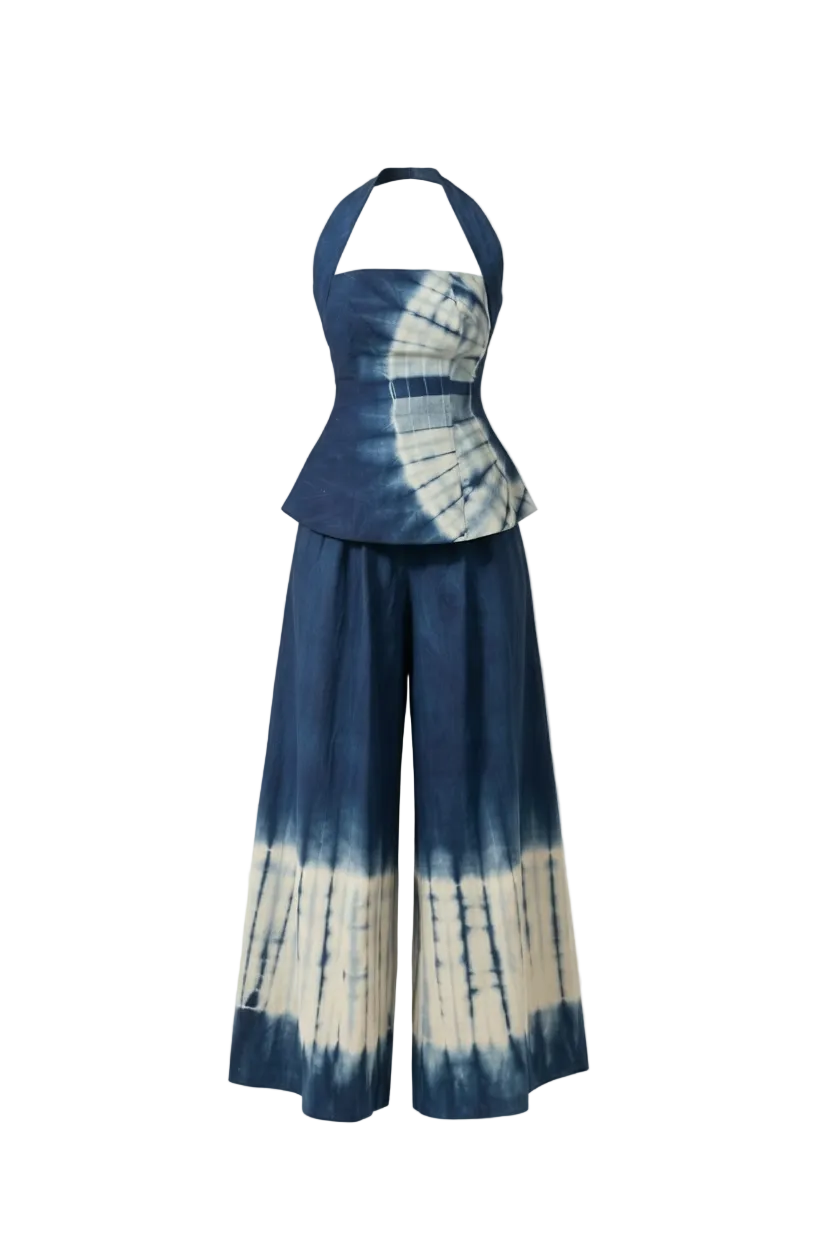 Tie-dye outfit with halter top and wide-leg pants on a white background