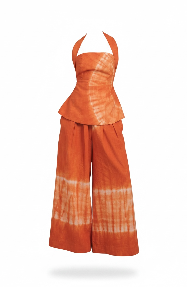 Orange tie-dye outfit with a halter top and wide-leg pants on a white background